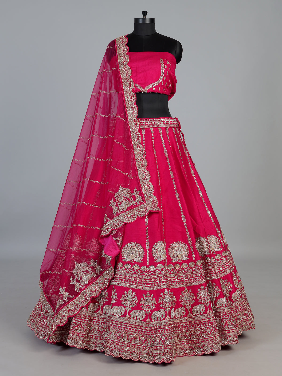 Rani pink bridal raw silk lehenga choli with embellished dupatta