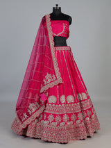 Rani pink bridal raw silk lehenga choli with embellished dupatta
