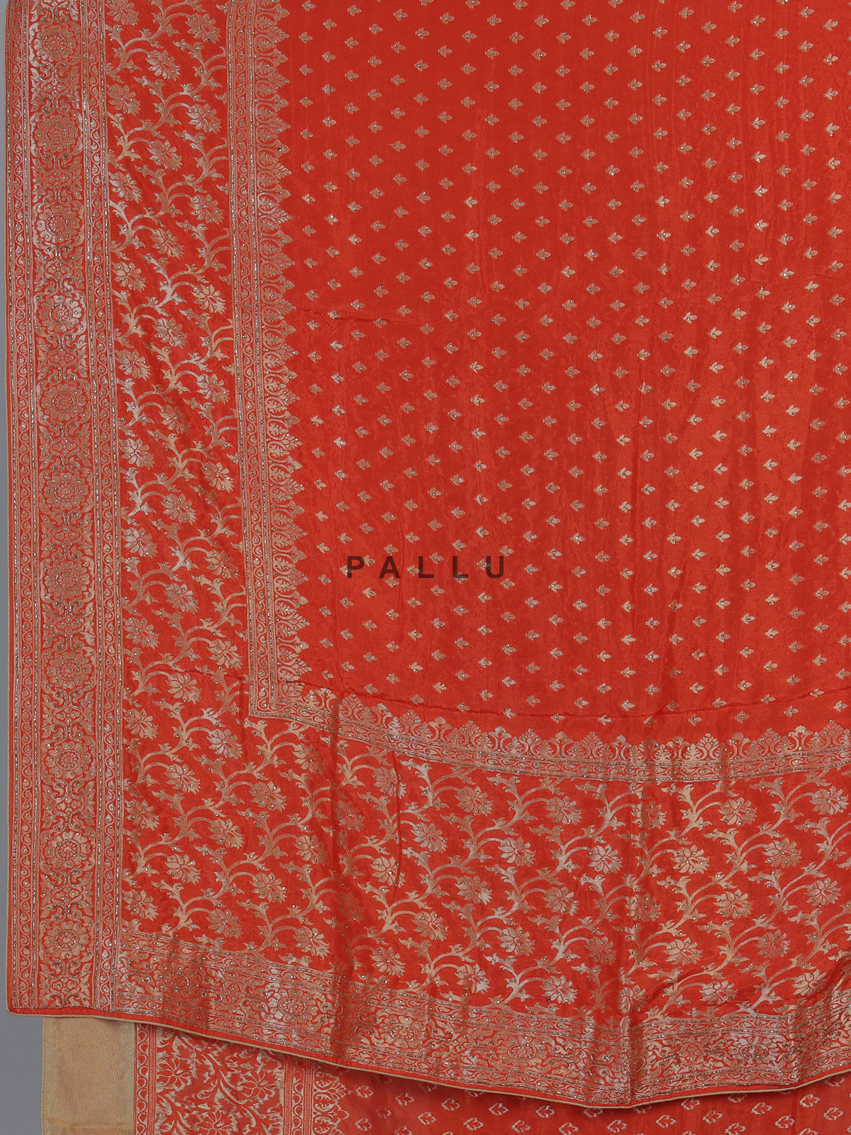 Rust orange premium dola silk saree with elegant zari artistry