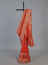 Rust orange premium dola silk saree with elegant zari artistry