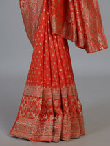 Rust orange premium dola silk saree with elegant zari artistry