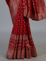Maroon royal dola silk saree with ornate zari woven border