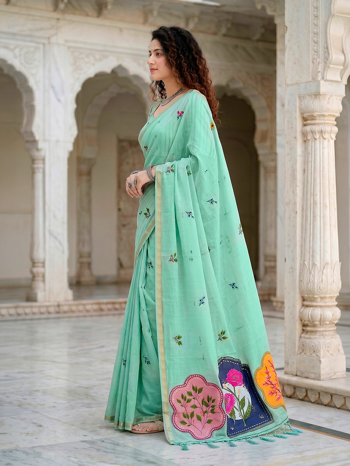 Mint blue printed cotton saree with handcrafted patch design