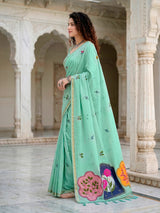 Mint blue printed cotton saree with handcrafted patch design