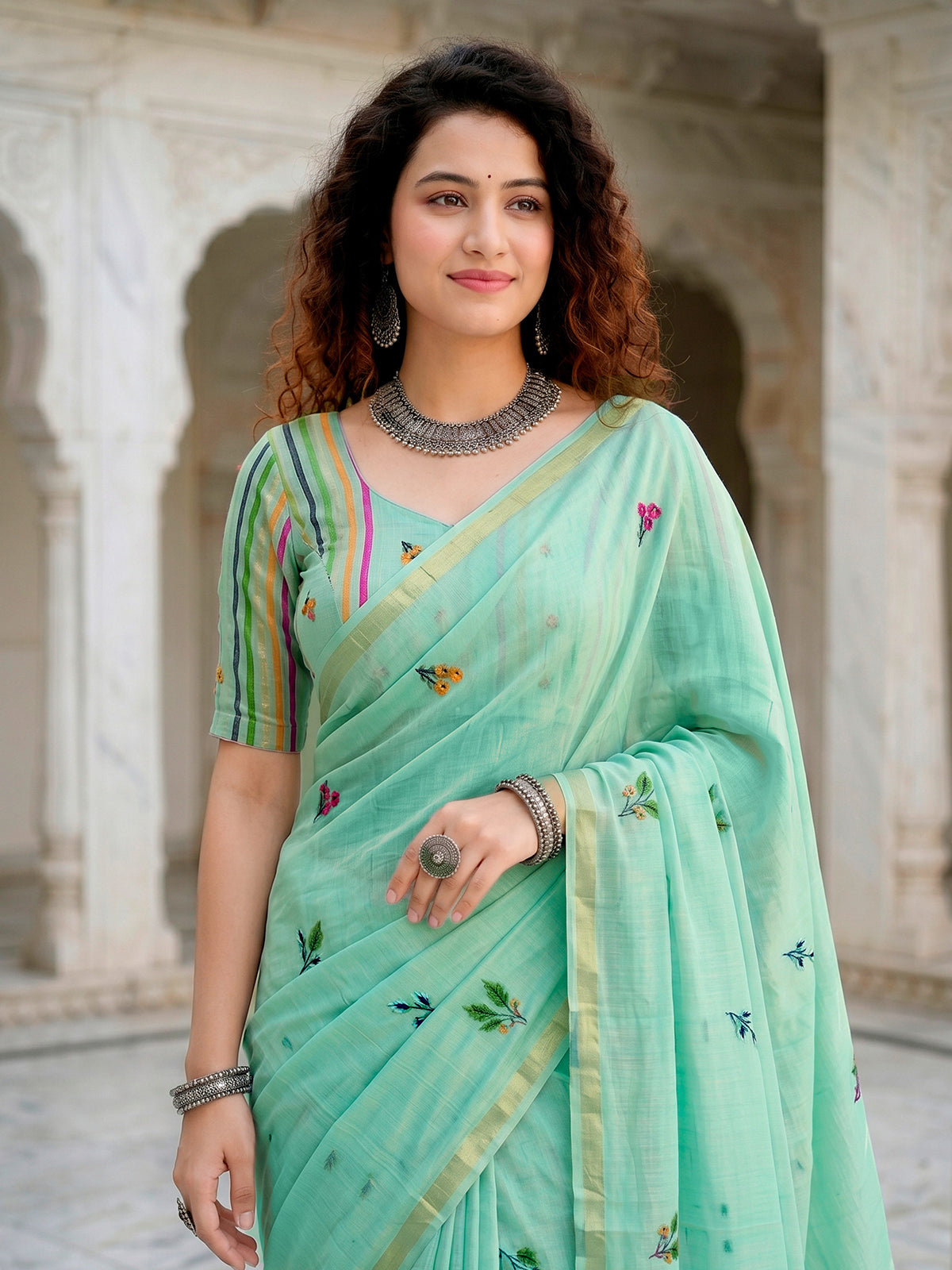 Mint blue printed cotton saree with handcrafted patch design