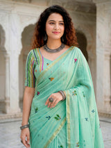 Mint blue printed cotton saree with handcrafted patch design