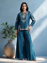 Blue designer silk sharara suit with contemporary asymmetrical style