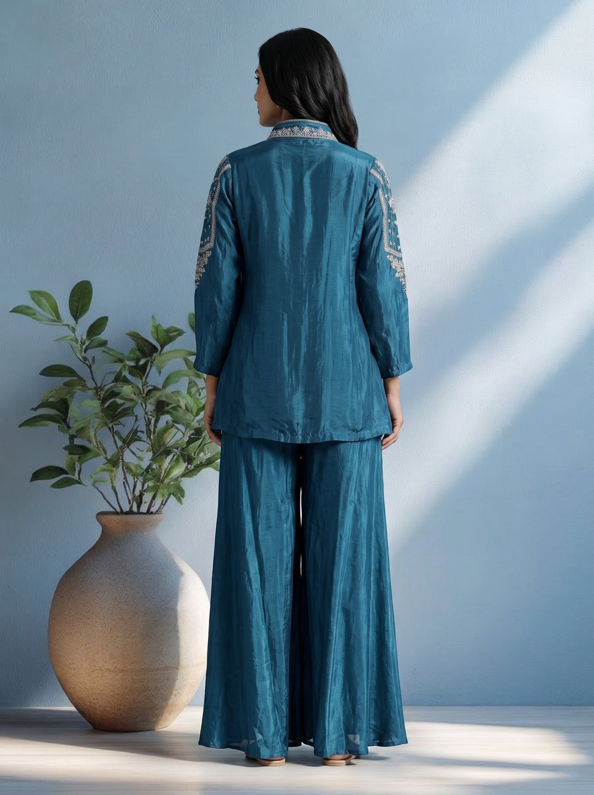 Blue designer silk sharara suit with contemporary asymmetrical style