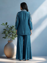 Blue designer silk sharara suit with contemporary asymmetrical style