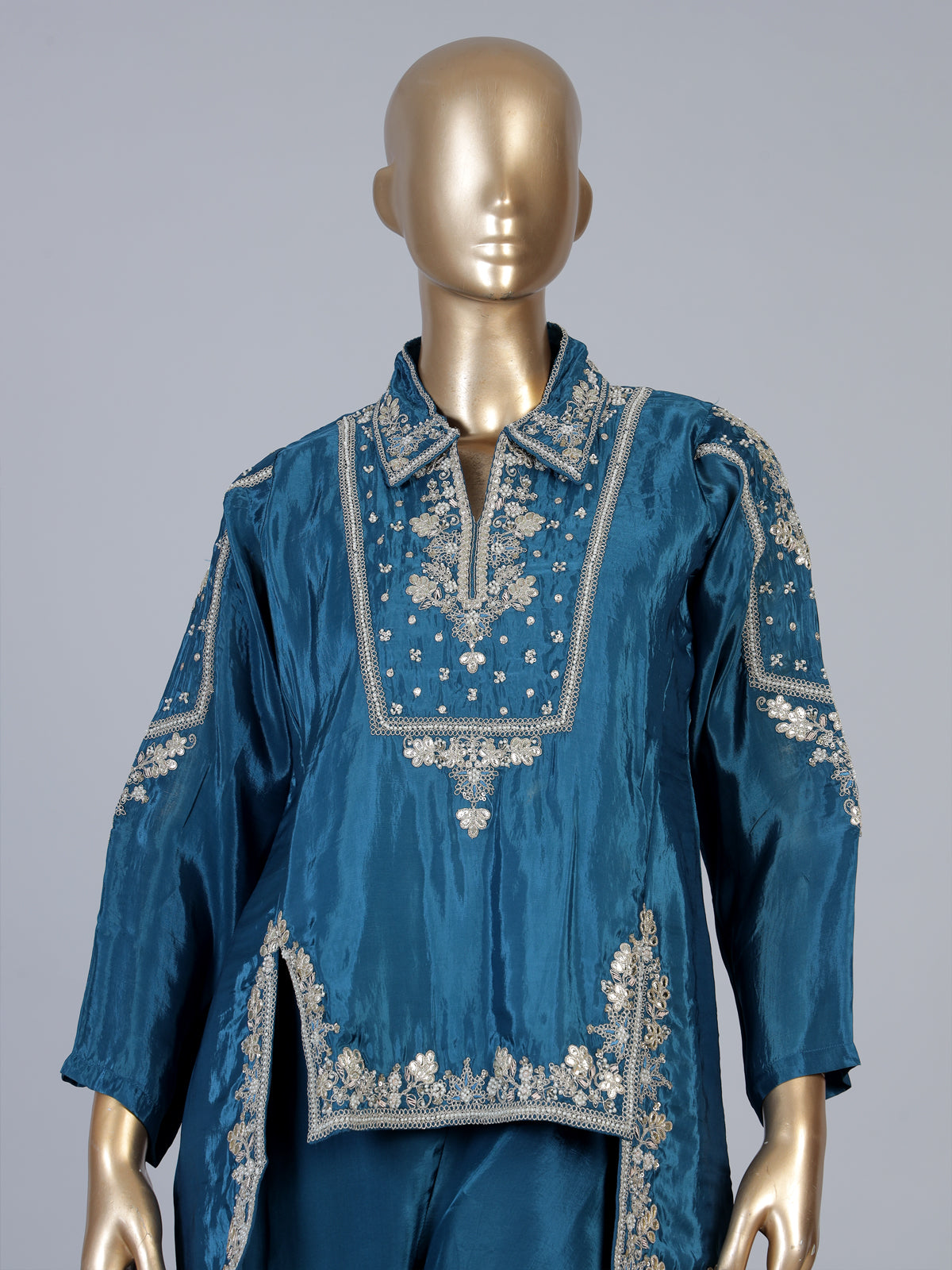 Blue designer silk sharara suit with contemporary asymmetrical style