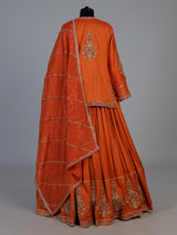 Rust orange raw silk lehenga choli with festive dupatta style