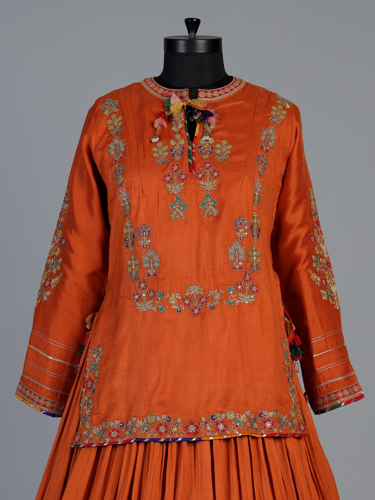 Rust orange raw silk lehenga choli with festive dupatta style
