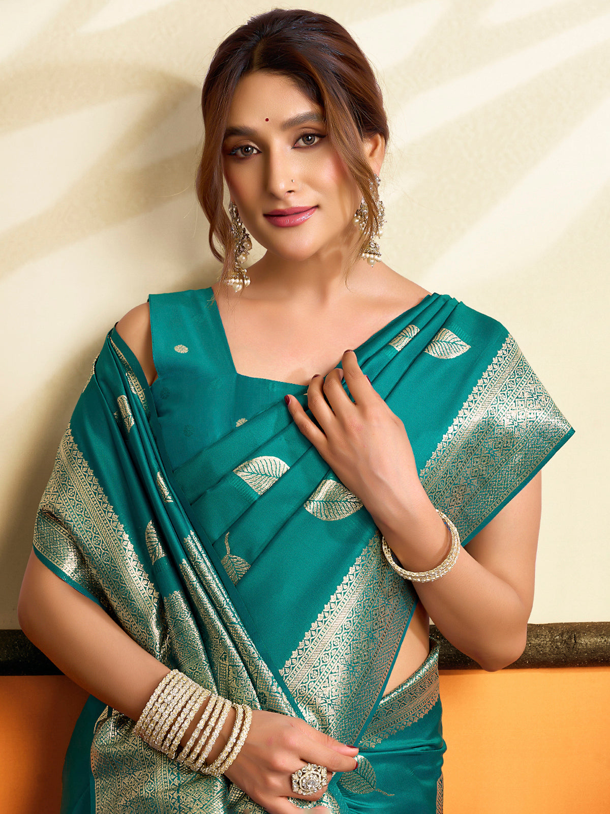 Rama green soft silk saree with zari embellished pallu tassels