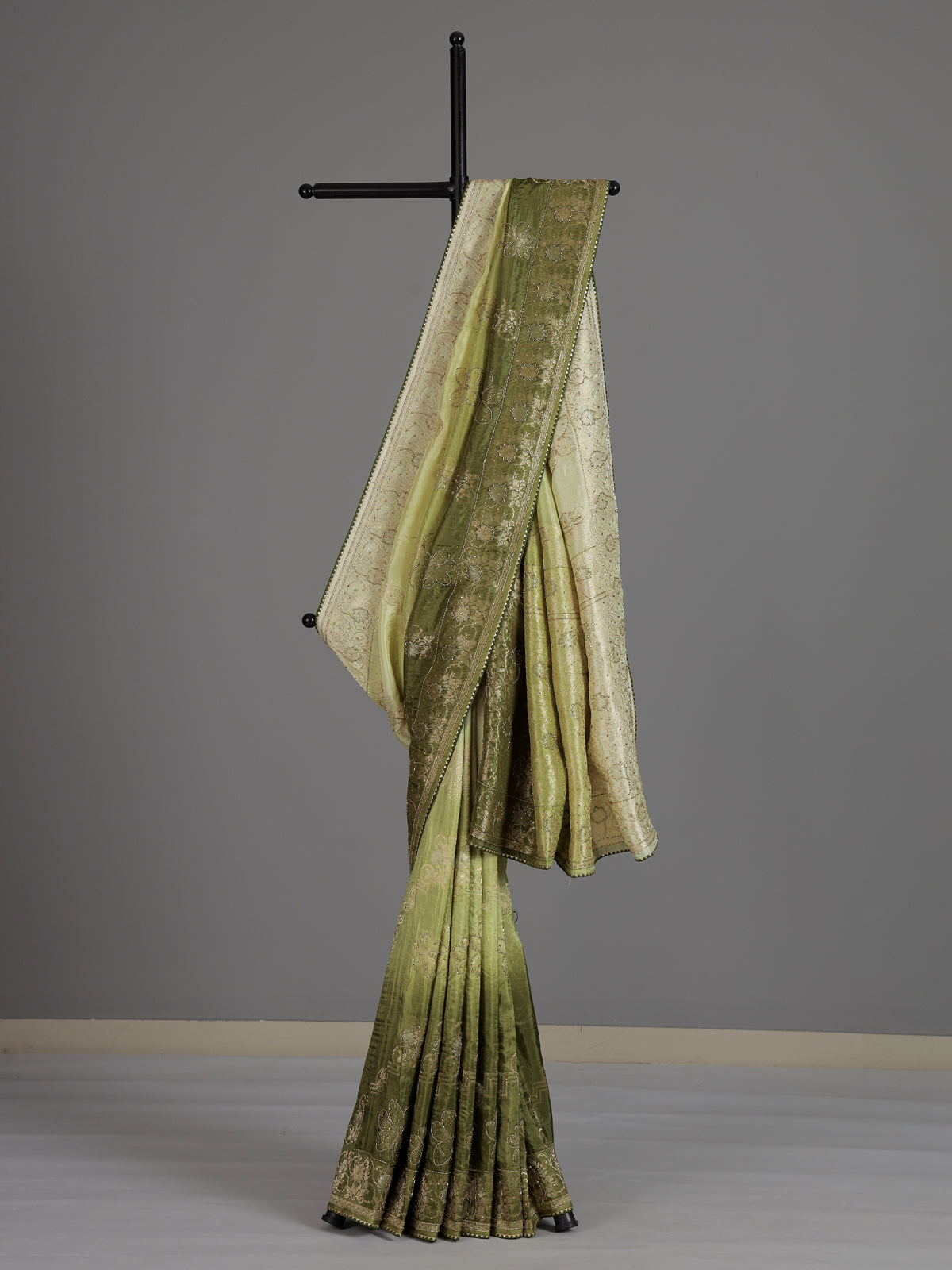 Mehendi green dola silk festive saree with graceful embellishments