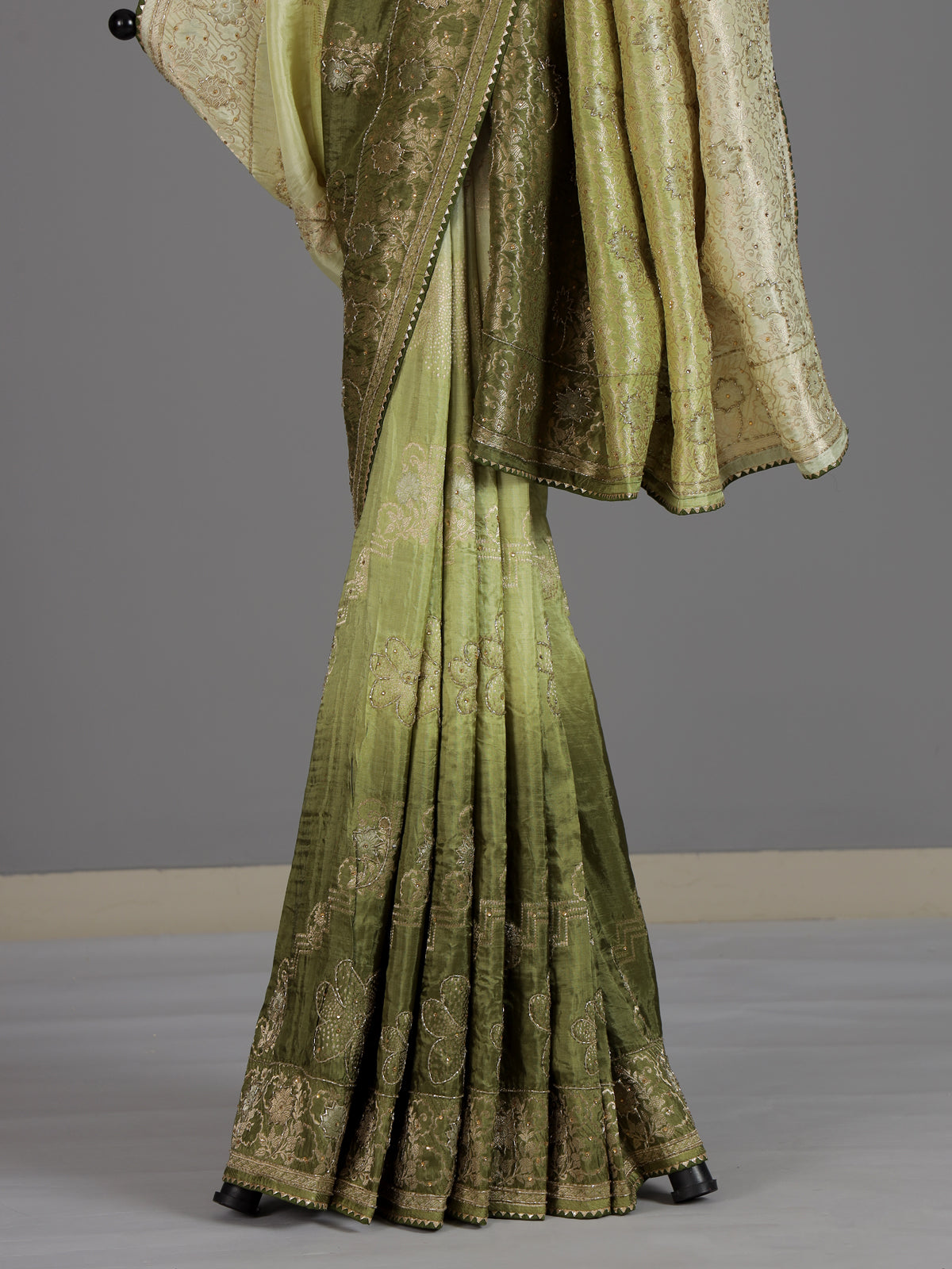 Mehendi green dola silk festive saree with graceful embellishments