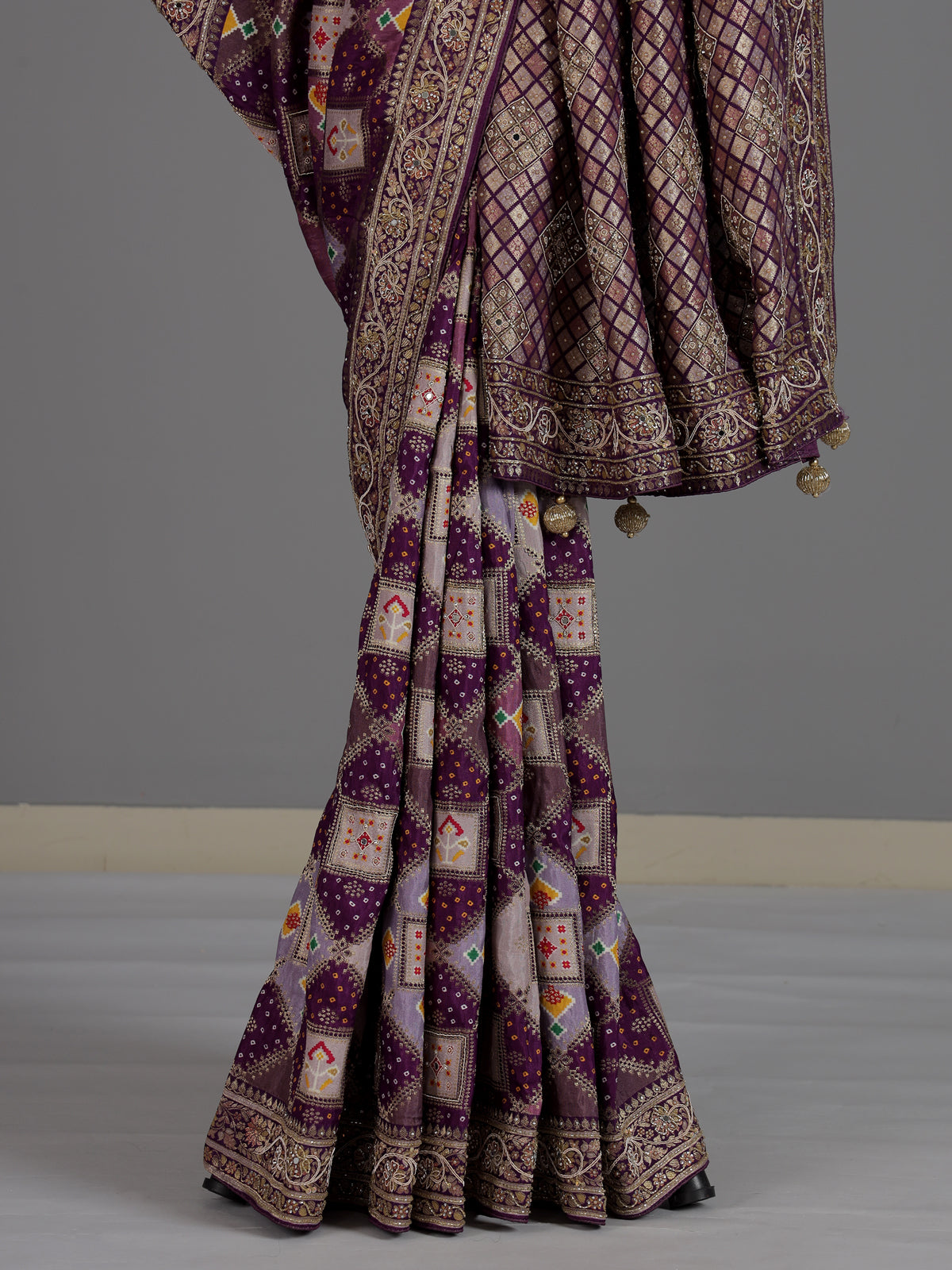 Purple bandhej printed dola silk saree with royal festive charm
