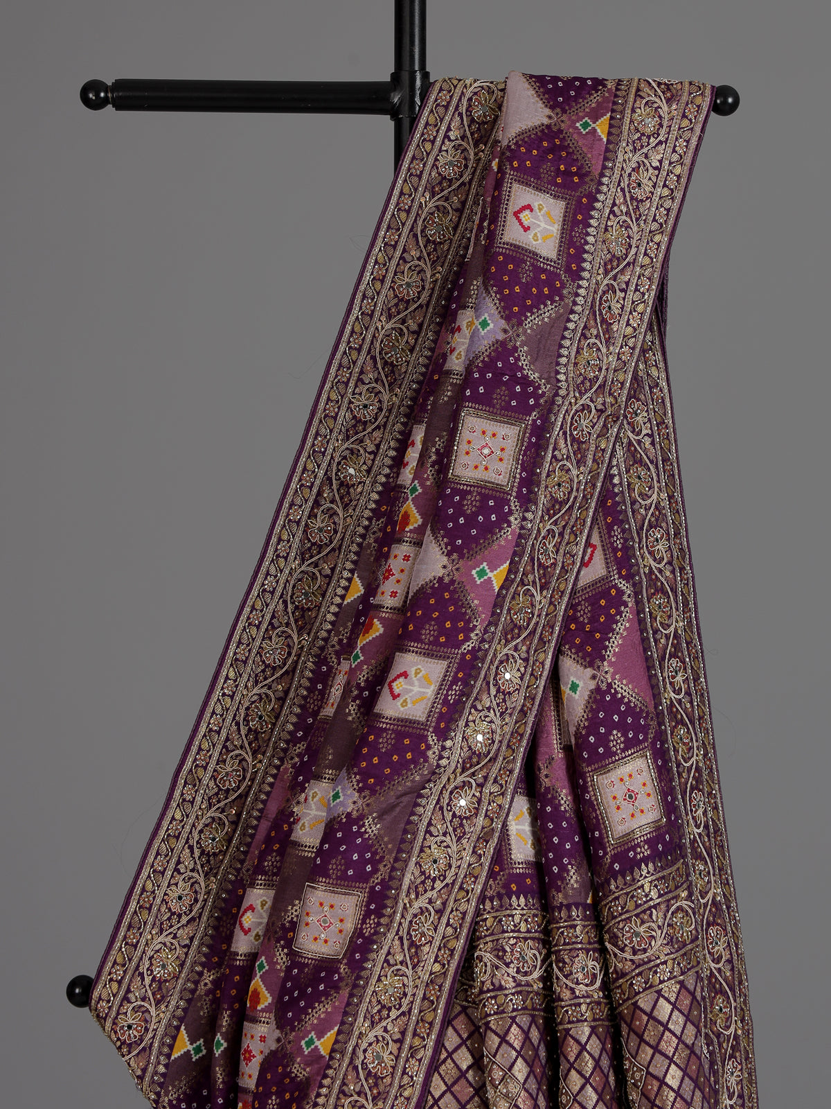 Purple bandhej printed dola silk saree with royal festive charm