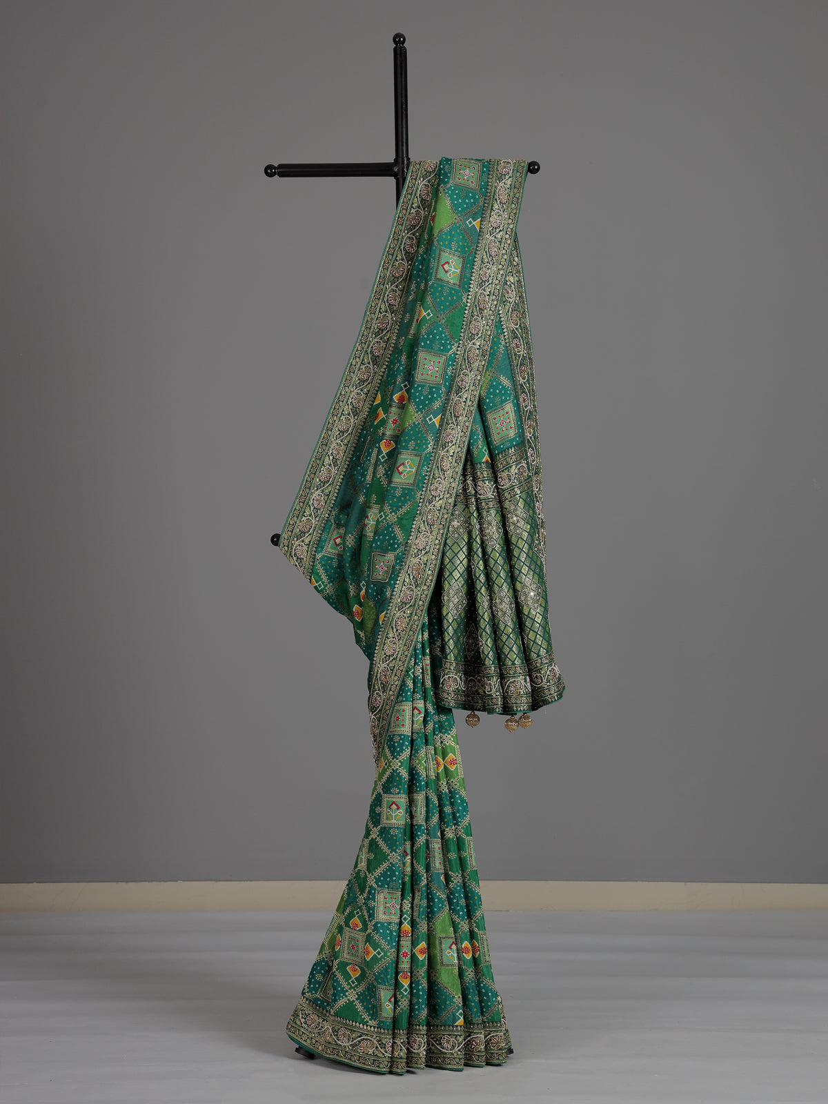 Green bandhej dola silk saree with traditional festive elegance