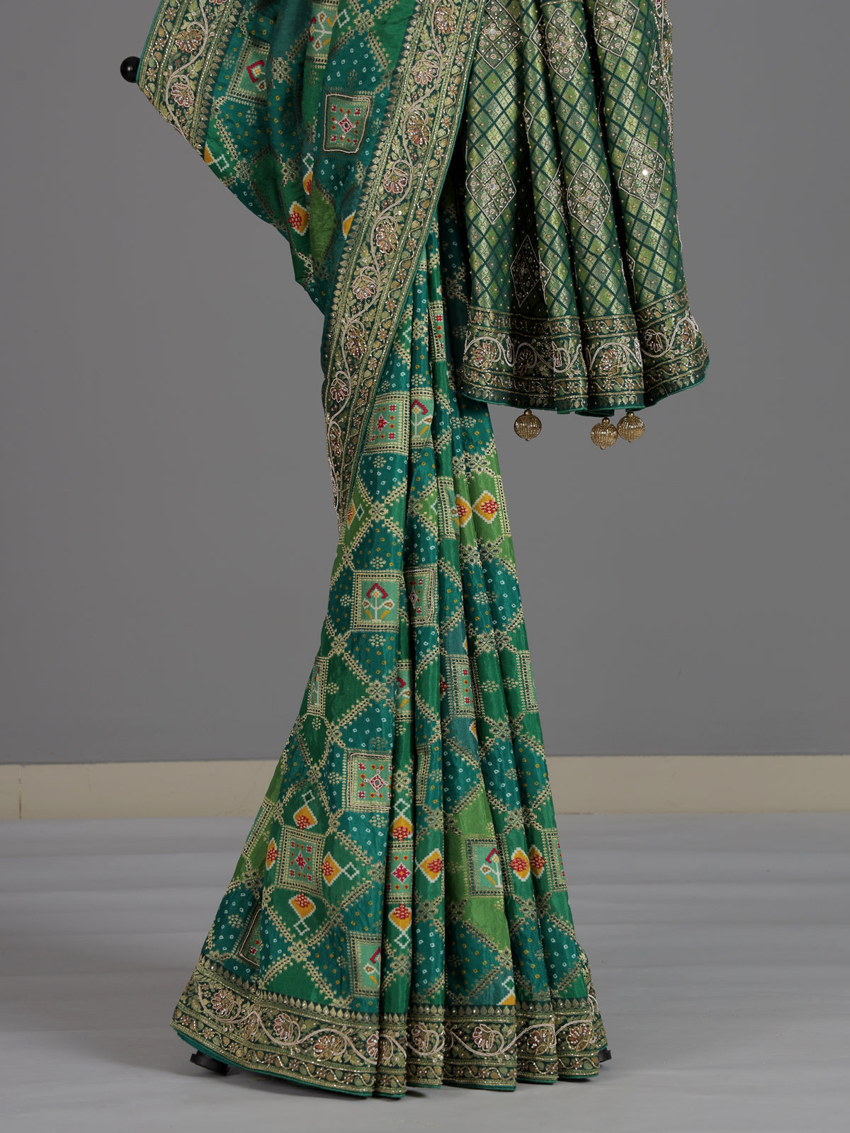 Green bandhej dola silk saree with traditional festive elegance