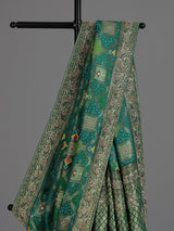 Green bandhej dola silk saree with traditional festive elegance