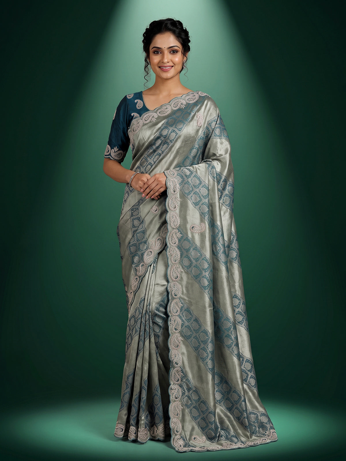 Teal blue tissue silk designer saree with elegant festive work
