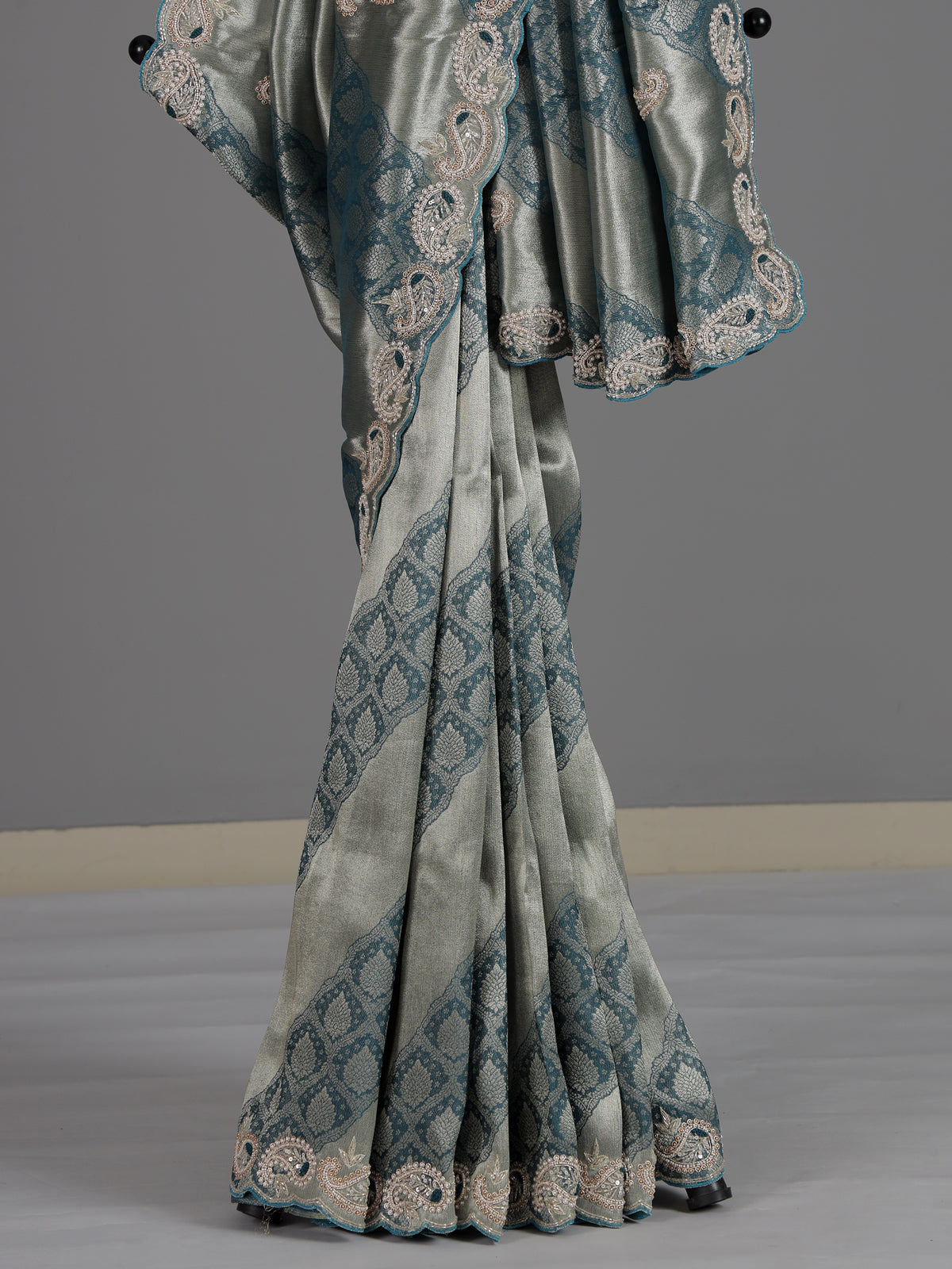 Teal blue tissue silk designer saree with elegant festive work