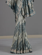 Teal blue tissue silk designer saree with elegant festive work
