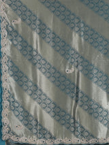 Teal blue tissue silk designer saree with elegant festive work