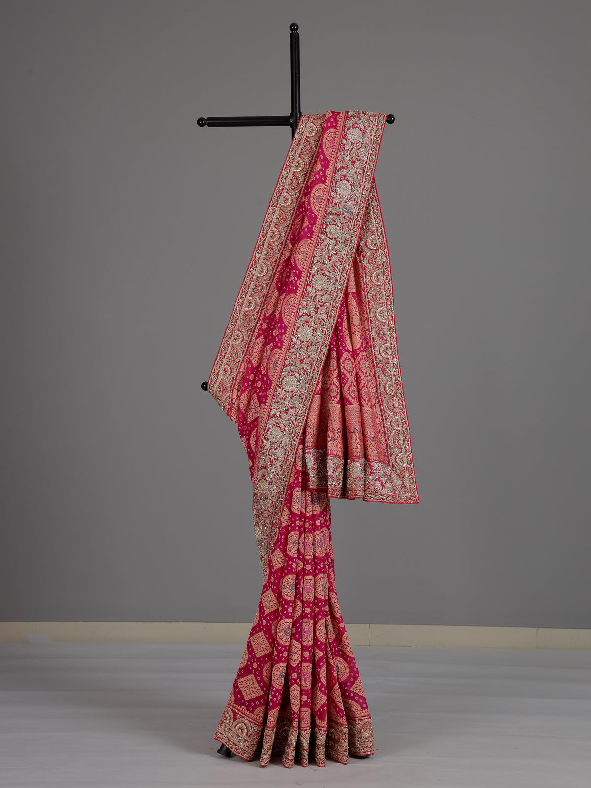 Rani pink bandhani georgette saree with traditional festive elegance