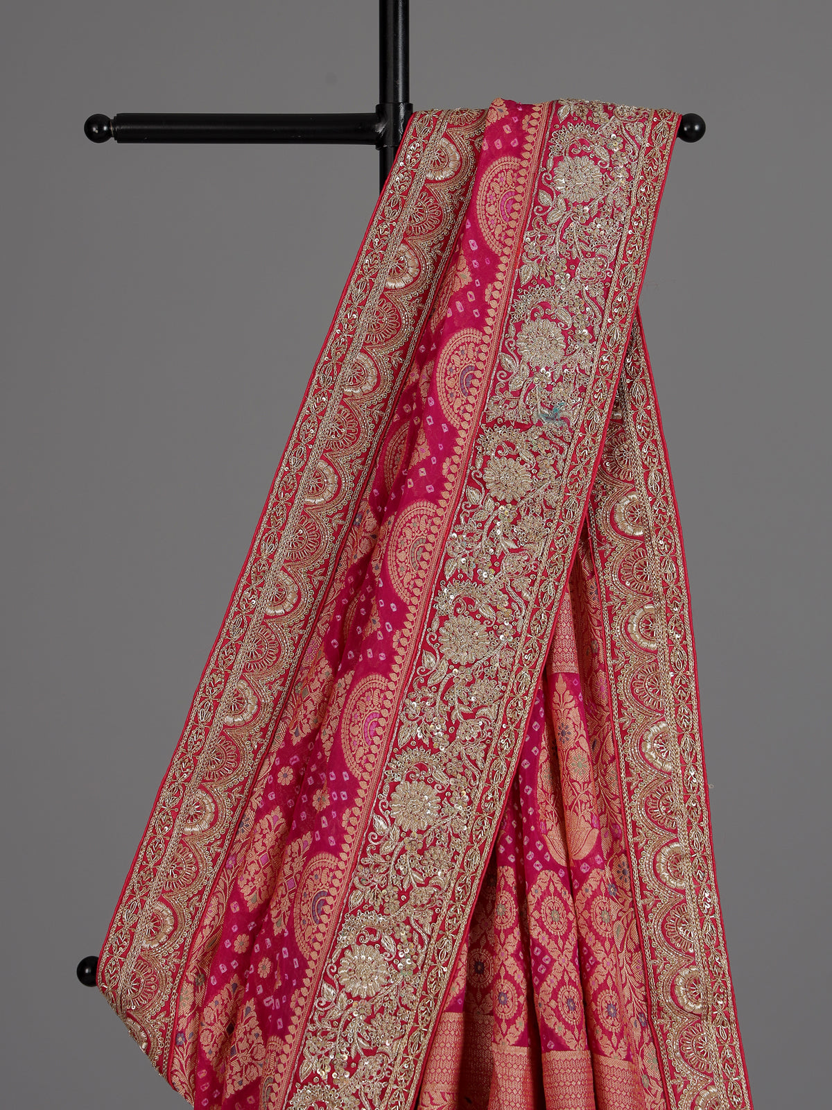 Rani pink bandhani georgette saree with traditional festive elegance