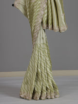 Pista green tissue dola silk saree with graceful festive