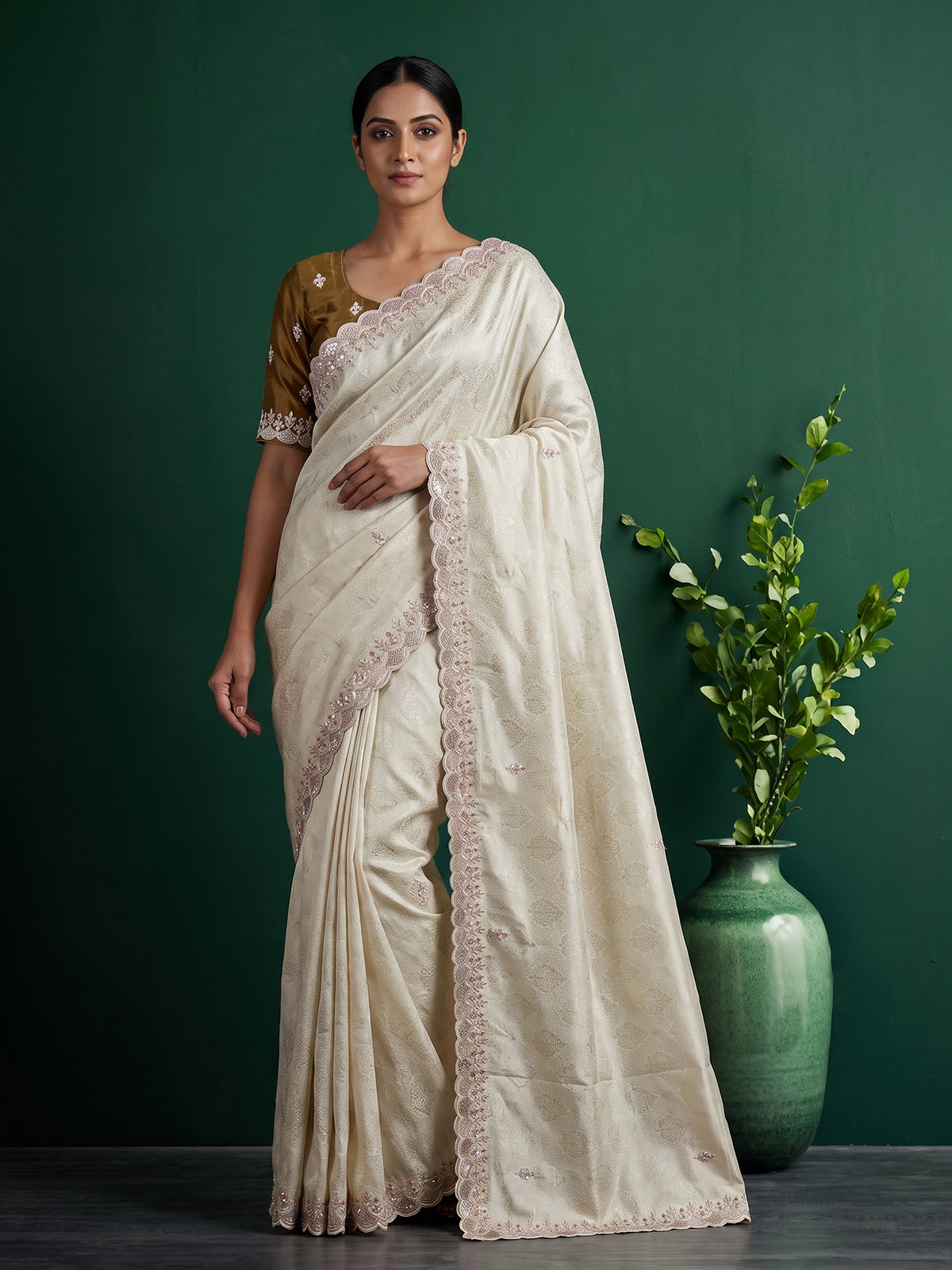 Off white tissue dola silk saree with timeless festive elegance
