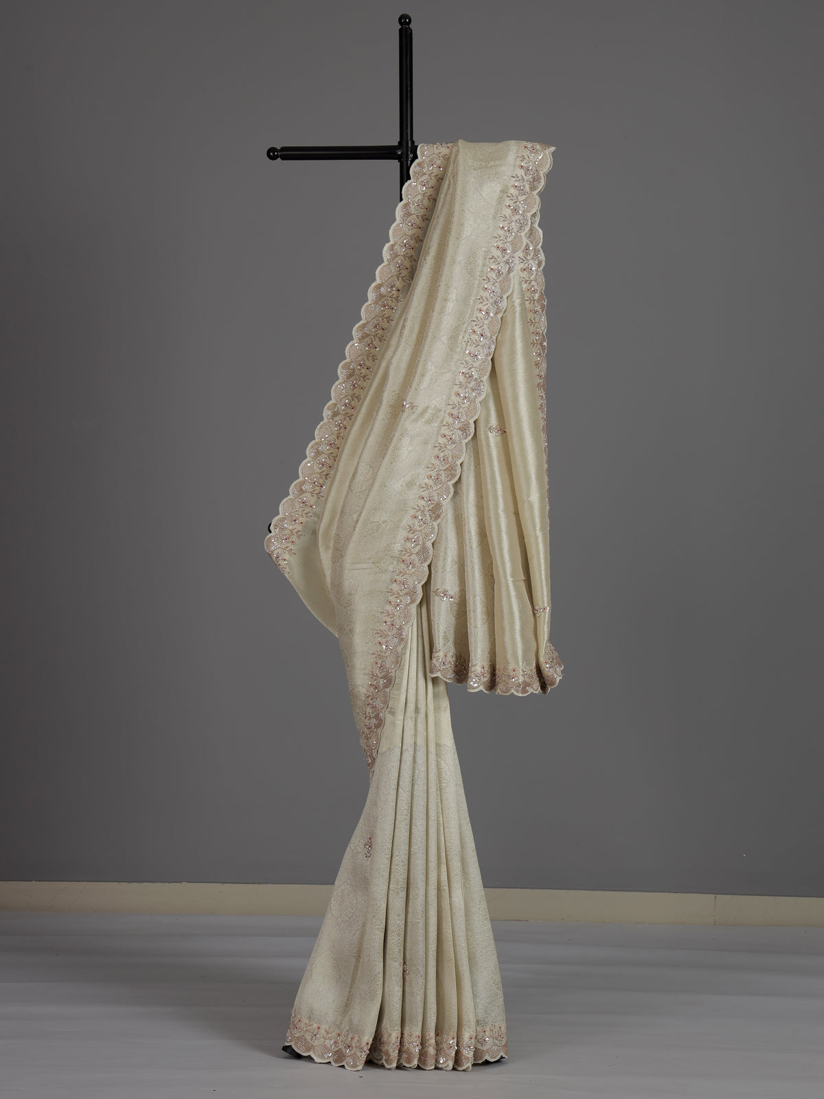 Off white tissue dola silk saree with timeless festive elegance