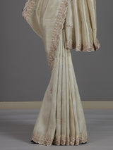 Off white tissue dola silk saree with timeless festive elegance