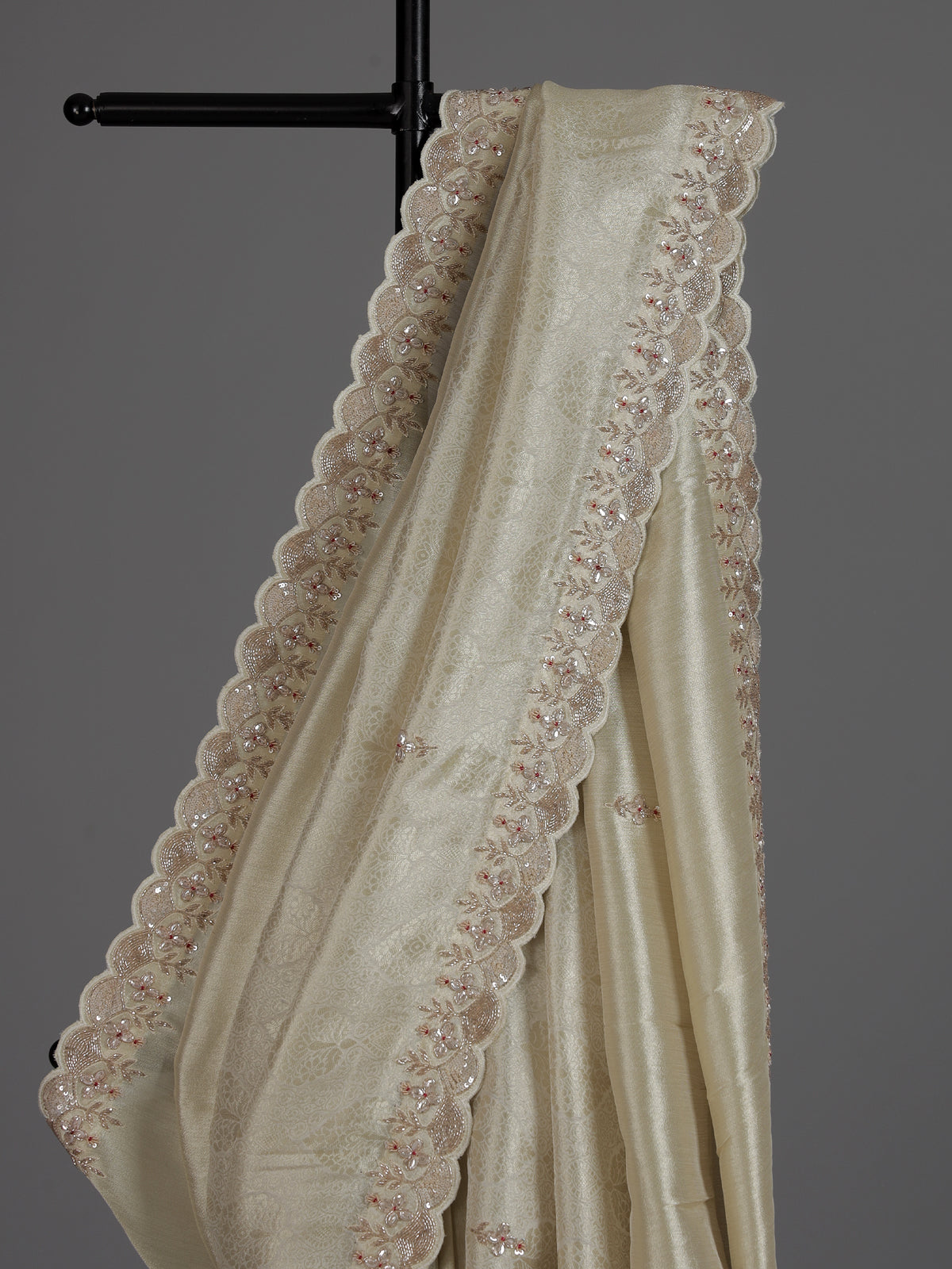 Off white tissue dola silk saree with timeless festive elegance