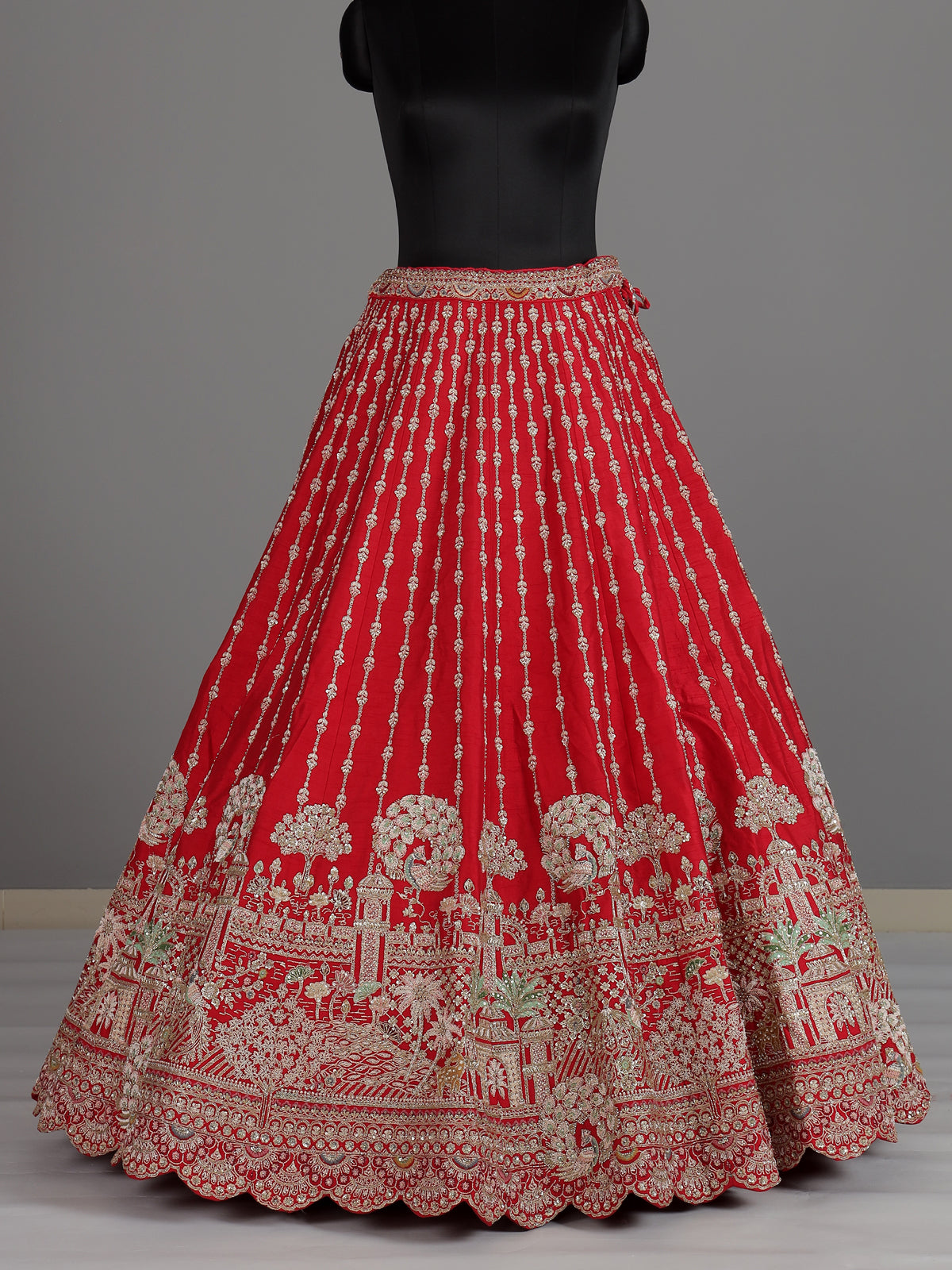 Red raw silk unstitched bridal lehenga choli with peacock motif
