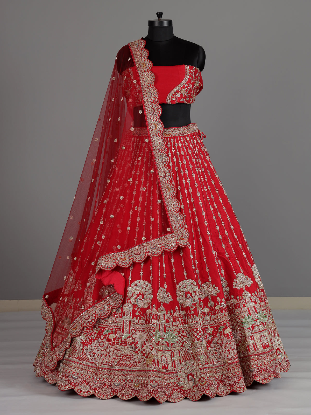 Red raw silk unstitched bridal lehenga choli with peacock motif