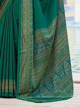 Green printed crepe silk casual saree with contrast border and pallu