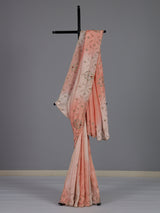 Graceful peach shaded dola shimmer saree for festive occasions