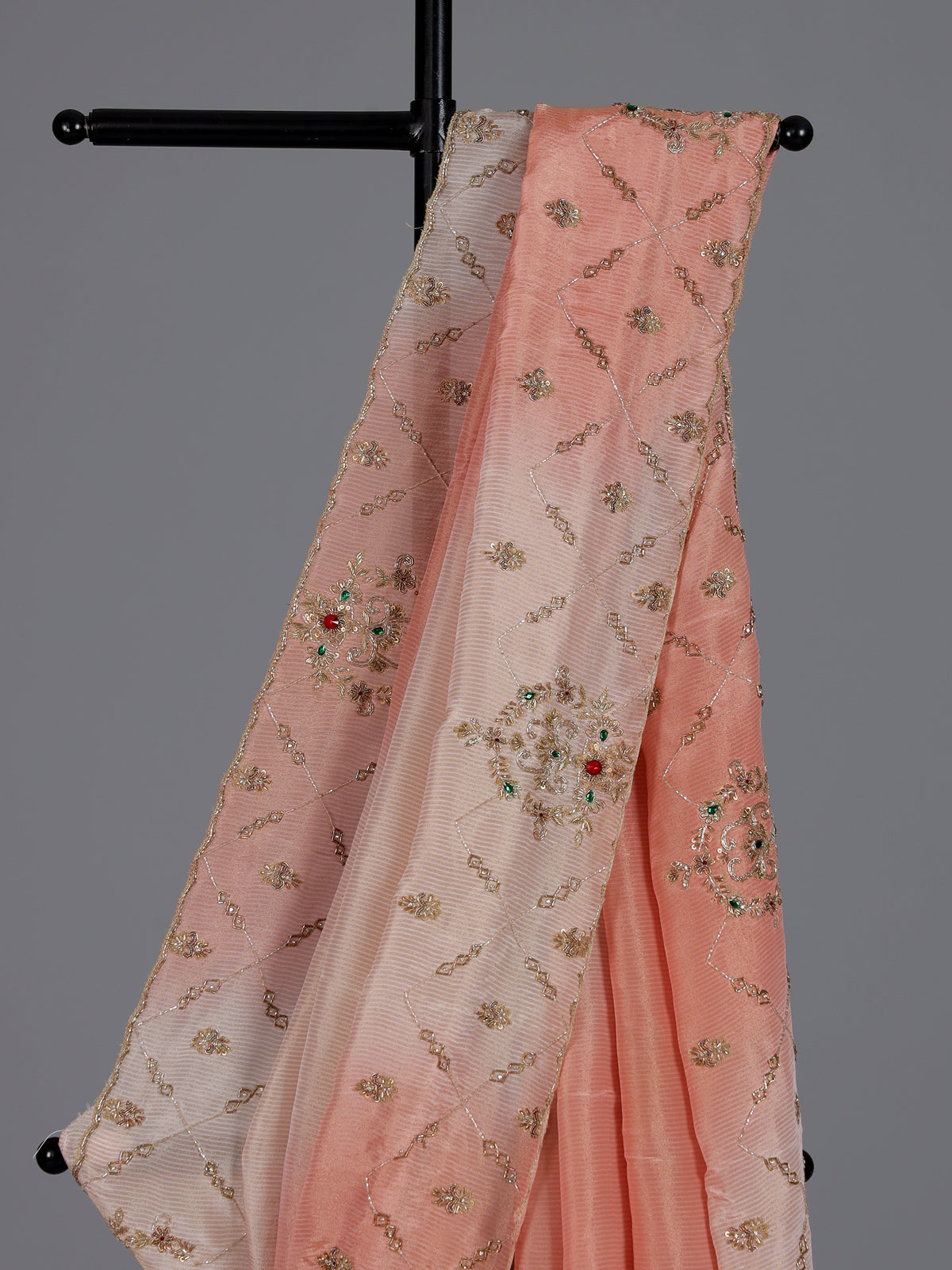 Graceful peach shaded dola shimmer saree for festive occasions
