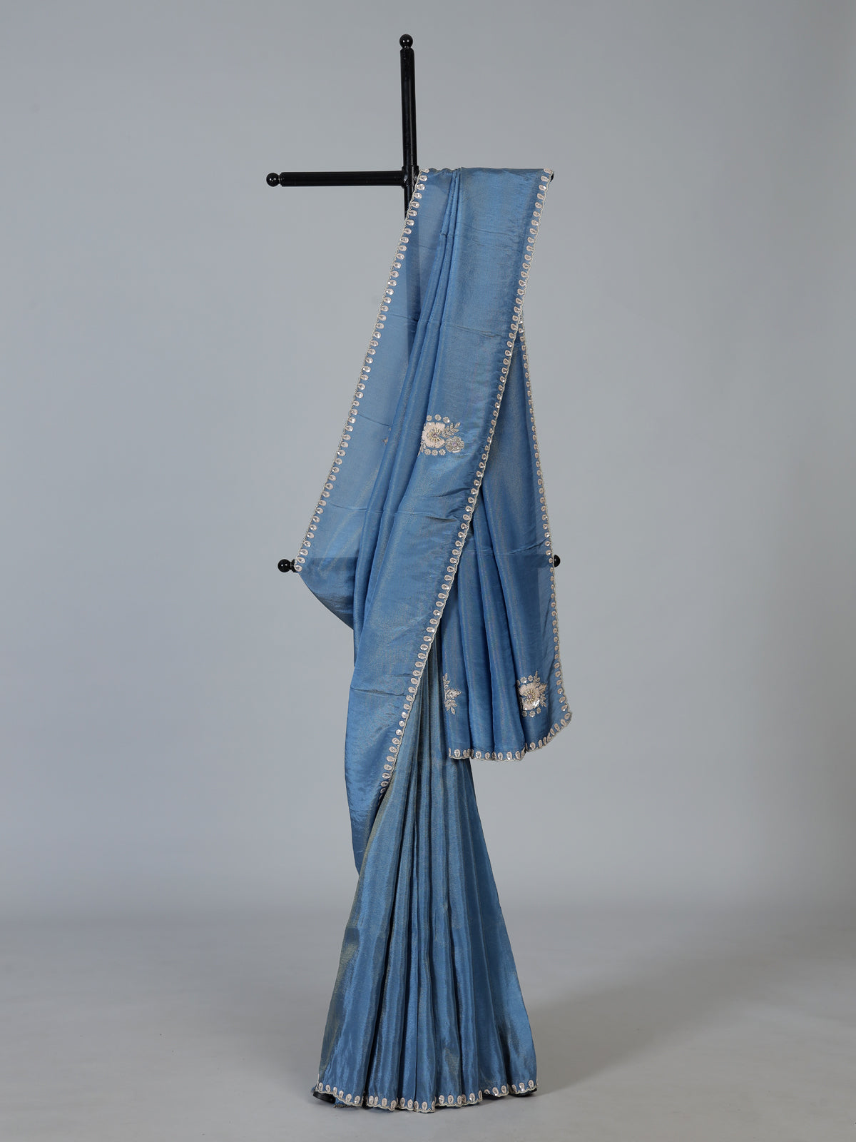 Stone blue shimmer dola silk designer saree with luxurious embellishments
