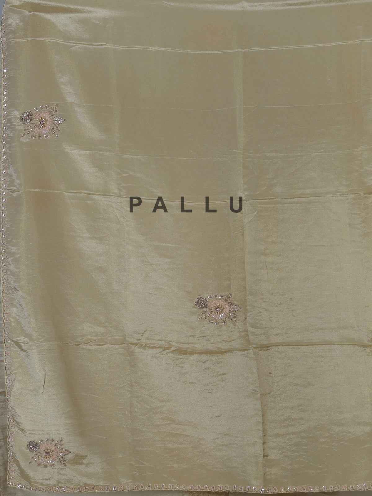 Cream shimmer dola silk festive saree with elegant handcrafted detailing