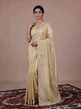 Cream shimmer dola silk festive saree with elegant handcrafted detailing