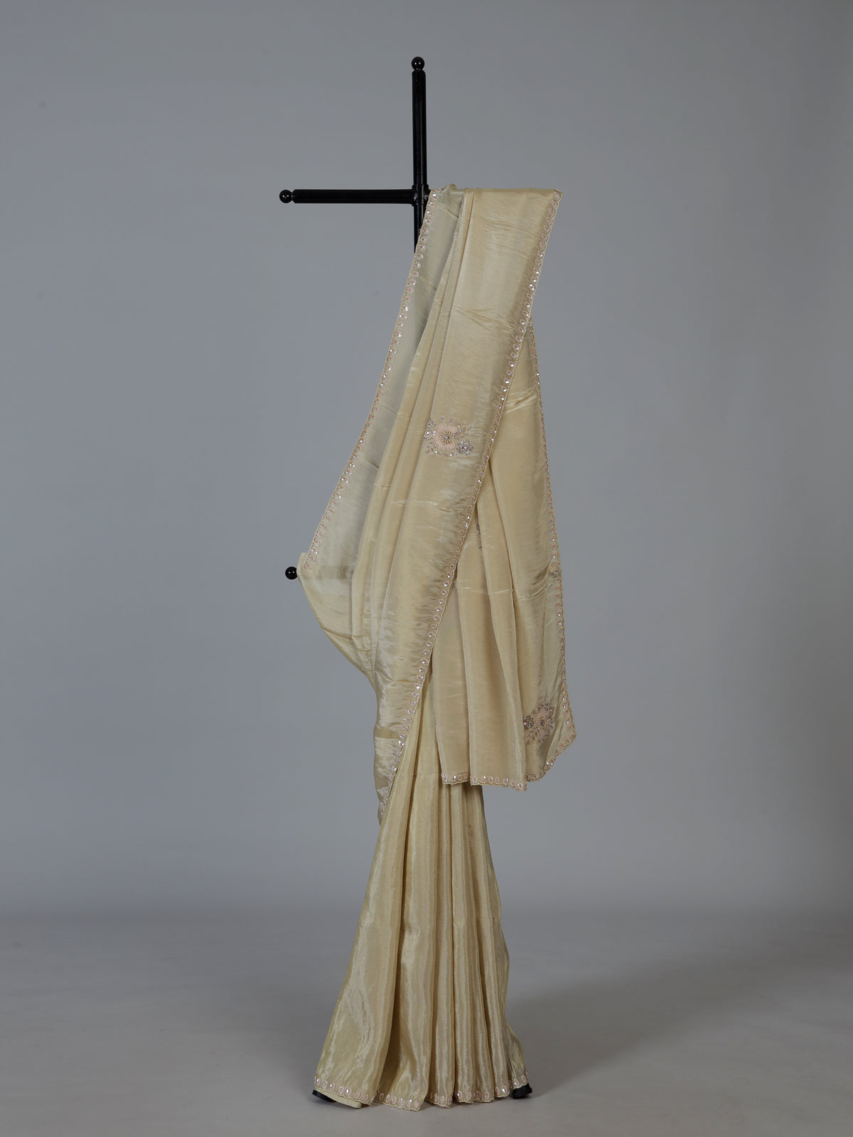 Cream shimmer dola silk festive saree with elegant handcrafted detailing
