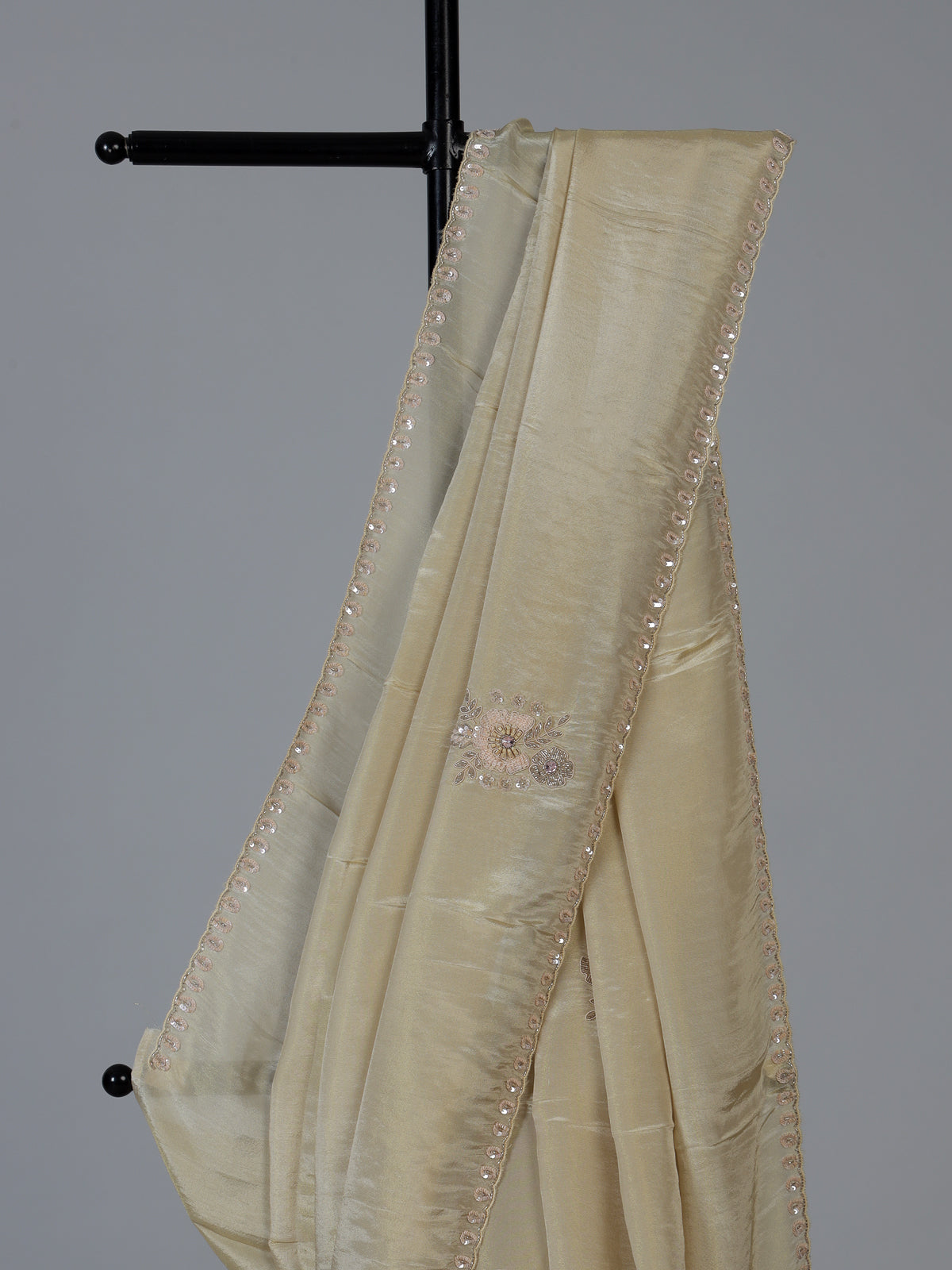 Cream shimmer dola silk festive saree with elegant handcrafted detailing