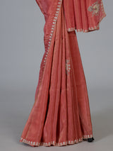 Pastel peach shimmer dola silk designer saree with radiant embellishments