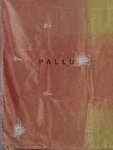 Peach shaded tissue silk designer saree with elegant festive shimmer