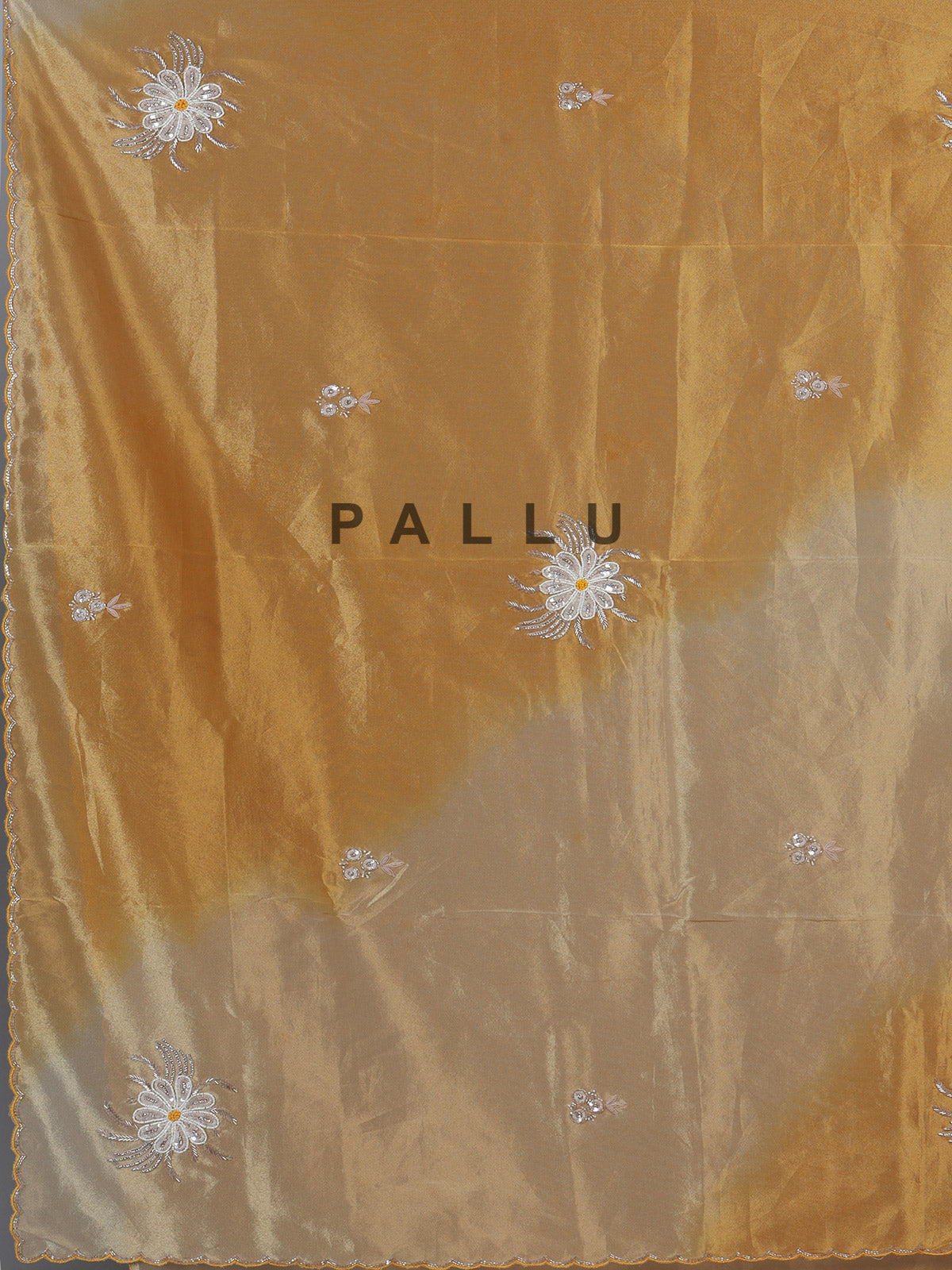 Golden and beige tissue silk festive saree with luxurious embellishments