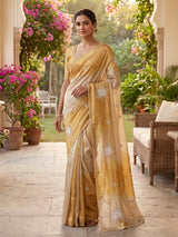 Golden and beige tissue silk festive saree with luxurious embellishments