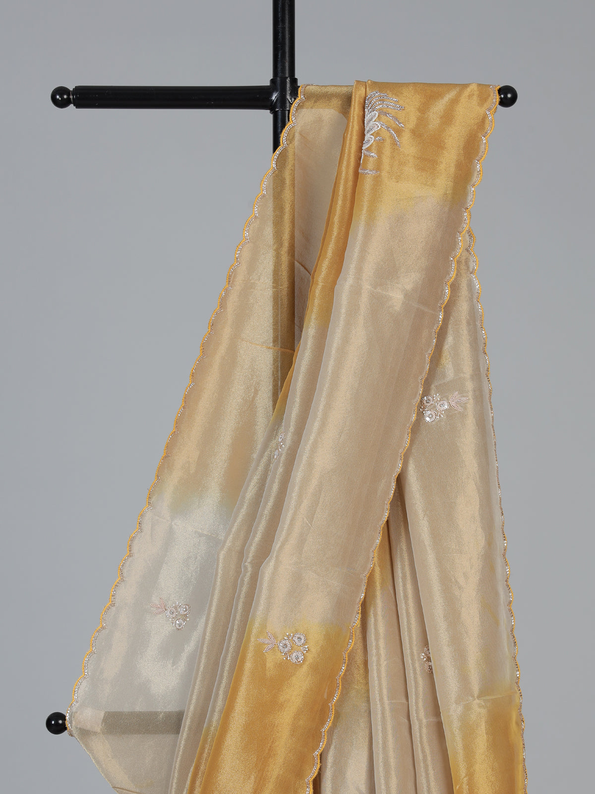 Golden and beige tissue silk festive saree with luxurious embellishments
